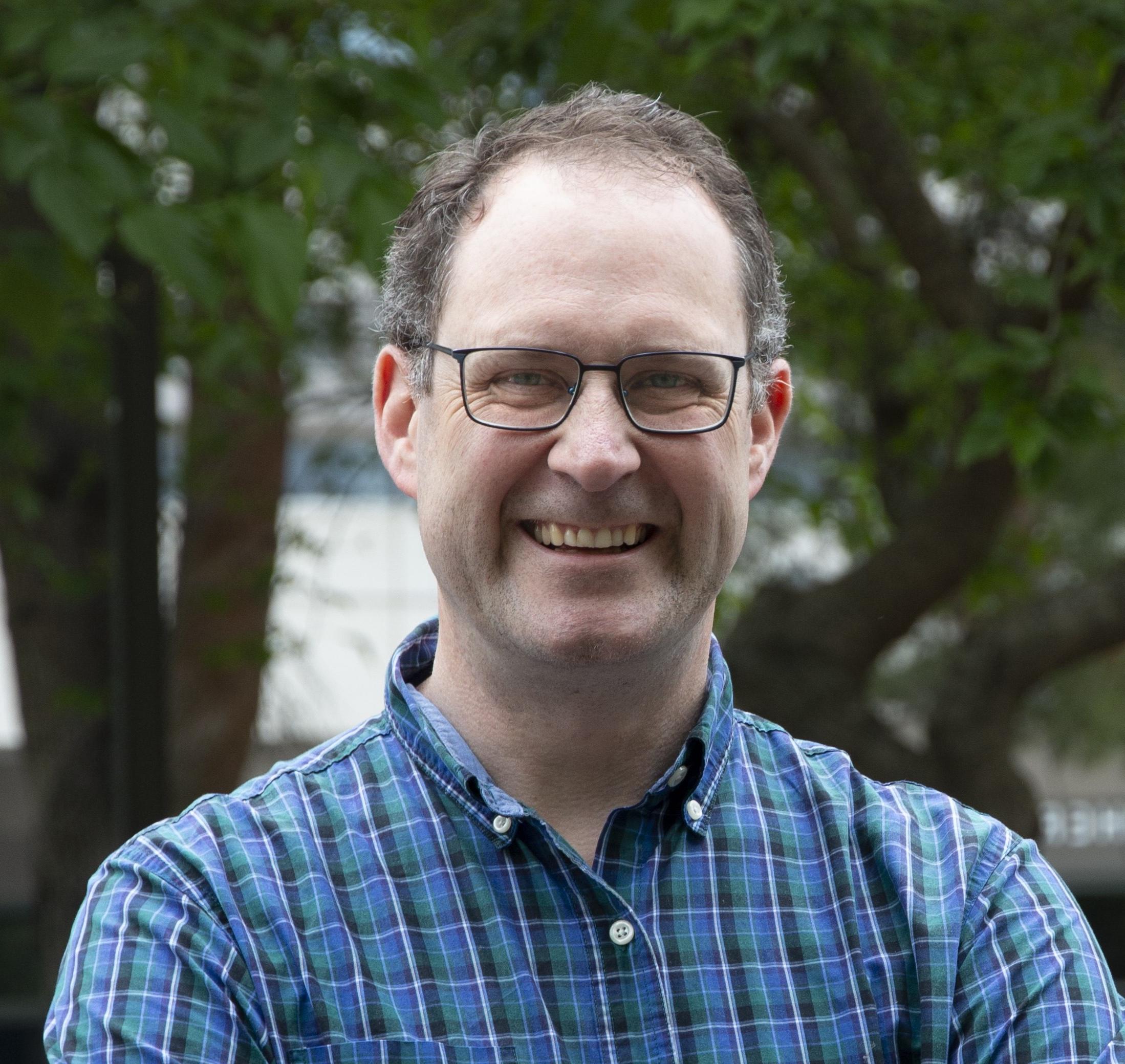 Headshot of Christopher Smallwood.