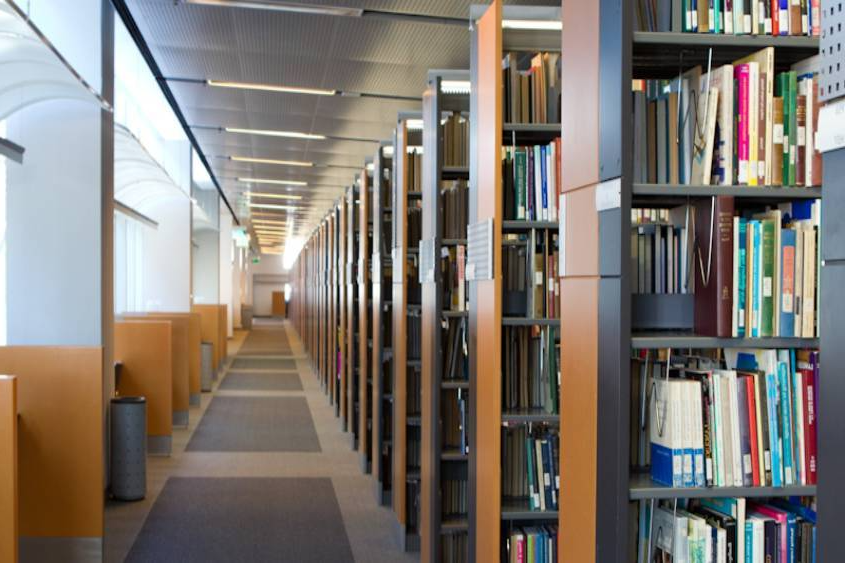 sjsu library books and hallway with desks